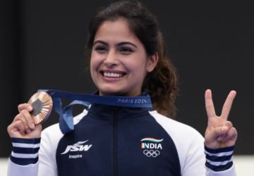 Manu Bhaker Holding a Bronze Medal in a Paris Olympic 2024